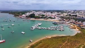 an aerial view of a harbor with boats in the water at JB RiaMar l by Meditrust in Alvor