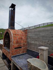 a brick oven sitting on top of a building at Zaovinska Panorama I in Bajina Bašta