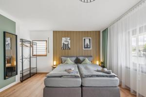 a bedroom with a large bed in a room at SleepHaven in Walldürn