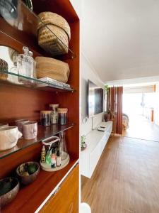 a kitchen with wooden floors and shelves with food at Oceanview 2BR with Terrace in Punta Hermosa in Punta Hermosa +8 photos