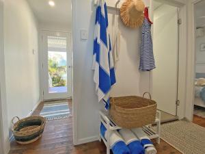 a room with a ladder and a mirror at Sandy Shores in Amity Point +15 photos