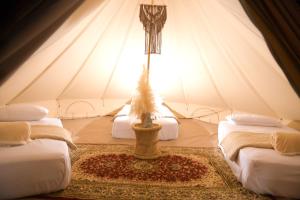 a room with two beds in a tent at Duna Camp Huacachina in Ica +37 photos