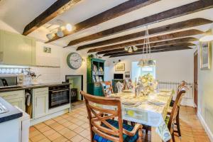 a kitchen and dining room with a table and chairs at Smithy House in Lochgilphead +34 photos