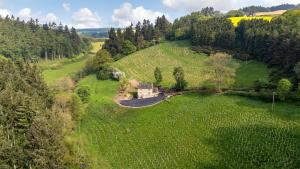 an aerial view of a house in a field at Fernhalls Mill in Munslow