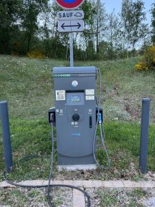 a gas pump with a sign on top of it at Brin d'Air Lodge in Montcornet +5 photos