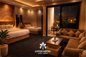 a hotel room with a bed and a couch at Lotus Hotel - Golden Square in Cairo