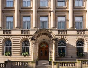 a large building with a door and stairs in front at Arthouse Glasgow - Newly Refurbished in Glasgow