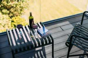 two glasses of wine sitting on a chair on a porch at Hotel Meudon in Falmouth +97 photos
