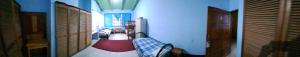 two images of a hallway with a room with at Overlooking Budget Hotel in San Pedro Sula +32 photos