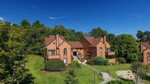 an image of a house with a yard at Seven Springs Resort Properties by Vail Resorts in Champion