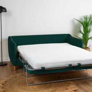 a bed in a room with a green couch at Cocon Hypercentre Aix-en-Provence in Aix-en-Provence