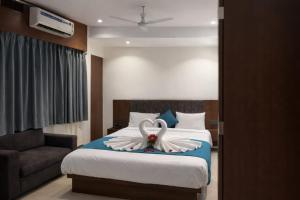 a bedroom with a bed with a swan decoration on it at Hotel maharaja in Udaipur +1 photo