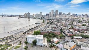 an aerial view of a city with a river at Nola Retreat Next To Frenchmen & French Quarter in New Orleans