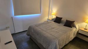 Llit o llits en una habitació de Palomar Centro