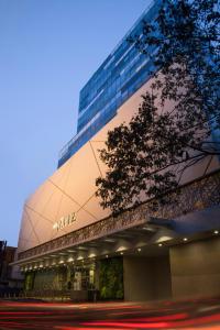 a building with a sign on the side of it at The Raviz Calicut in Kozhikode