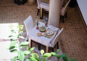 an overhead view of a table with plates of food on it at Riad Nirvana in Marrakesh +72 photos