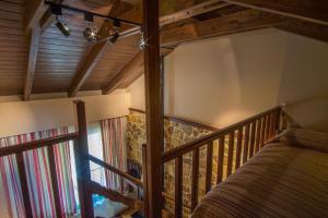 Łóżko lub łóżka w pokoju w obiekcie Orizontes Tzoumerkon Hotel Resort