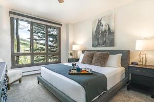 a bedroom with a large bed and a window at 104 Highlands Westview in Avon