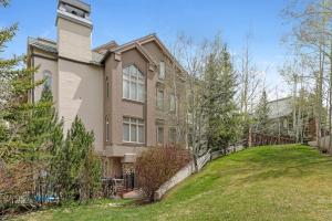 a house on a hill with a yard at 104 Highlands Westview in Avon