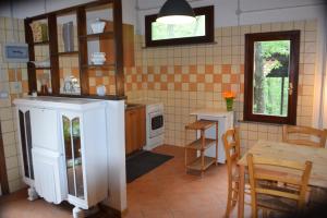a kitchen with a table and a dining room at Camporegio in Civitella Cesi