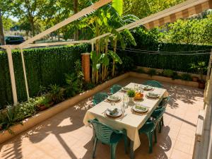 a table and chairs sitting on a patio at PLATANERA apart in Calafell