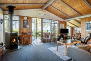 a living room with a couch and a fireplace at FY418-Faaborg-Fruerlund-48 in Faaborg