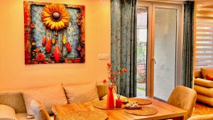 a living room with a table and a couch at Villa ARIA in Trpejca