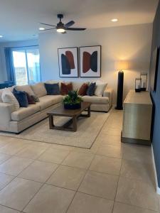 a living room with a couch and a coffee table at Clark's Luxury Apartment in Phoenix
