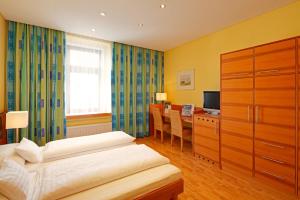 Postel nebo postele na pokoji v ubytování Hotel Central