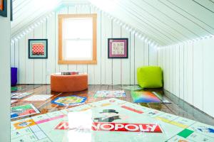 a room with a room with a table and a window at Family Fun Indoor Play Zone UP Waterfalls in Bessemer