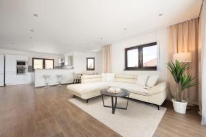 a living room with a couch and a table at Dům Pavlov in Pavlov