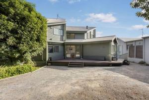 a house with a large driveway in front of it at The Ridge House Panoramic views in Aireys Inlet