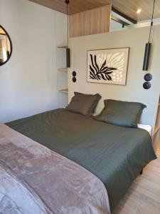 a bedroom with a large bed in a room at Stellira - Vakantieverblijf in Zonhoven