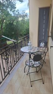 a table and chairs on a balcony with a view at House on the road in Telti