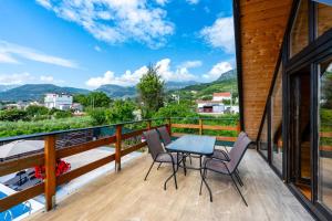 a balcony with a table and chairs and a view at Villa Ksenija with Private Pool- Peace & Privacy in Bar