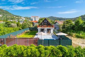 a house in a vineyard with umbrellas at Villa Ksenija with Private Pool- Peace & Privacy in Bar +21 photos