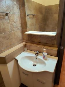 a bathroom with a sink and a mirror at brezza marina in Siderno Marina +23 photos
