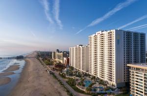 a view of a beach and buildings and the ocean at Ocean Walk Resort in Daytona Beach