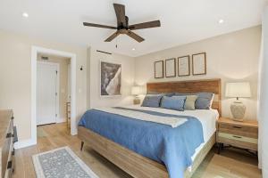 a bedroom with a bed and a ceiling fan at Park Shore Resort by Mike Z Rentals in Naples +80 photos