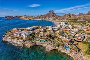 an aerial view of a resort in the ocean at Ocean Light at Villa Hermosa in San Carlos