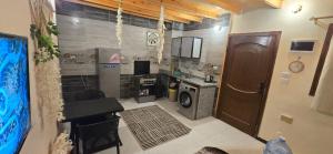 a kitchen with a washing machine and a stove at Nada house in Dahab +31 photos