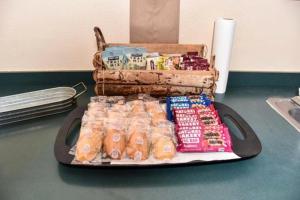 a tray of packaged food and a suitcase on a table at Eagle Peak Lodge & Cabins in Ashton +13 photos