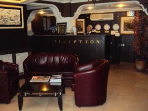 a man sitting at a bar in a waiting room at Mevlana Hotel in Konya