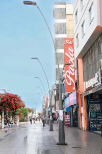 a city street with people walking down the street at Hotel Paola Antofagasta in Antofagasta