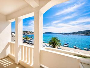a view of the water from the balcony of a house at Ap AS in Rogoznica