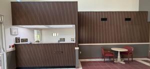 a waiting room with a table and two chairs at Regency Inn & Suites in Milton