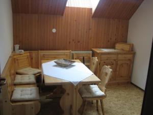 a dining room with a table and chairs at Apartment Marinka in Bled