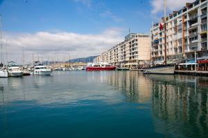 a marina with boats in the water next to buildings at Studio Equerre in Toulon