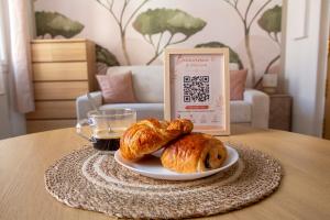 a table with a plate of croissants and a sign at Studio Equerre in Toulon