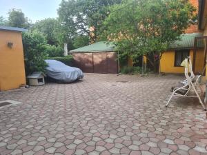 a patio with a mattress and a tent in a yard at Rusu Sirianu rooms in Timişoara